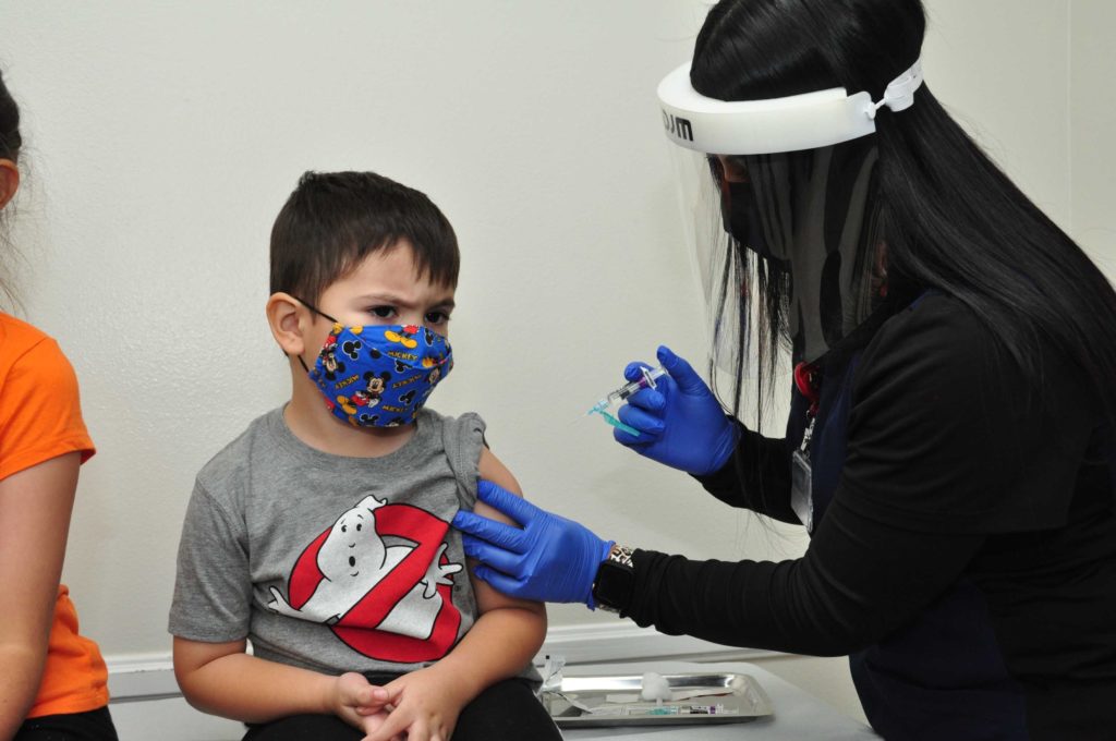 Aiden Cruz 4 receives a vaccination from LaSalle Medical Associates Nurse Megan